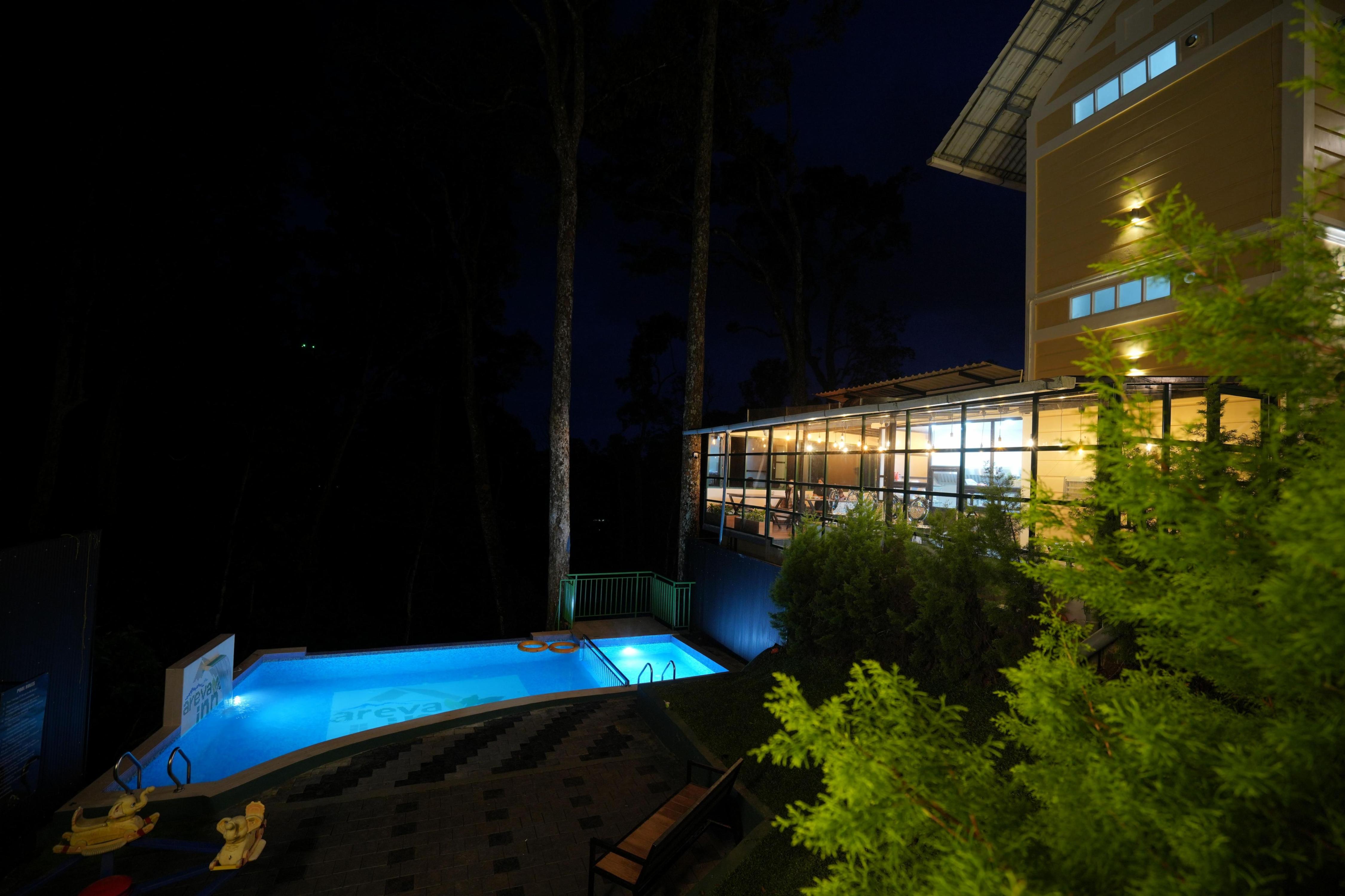 Areva Inn Pool Resort Munnar by VOYE HOMES - Tap to explore photos