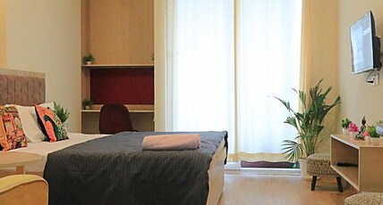 The Taj Studios-Comfortable Stay At Gaur City MAll Room Type - Bedroom
