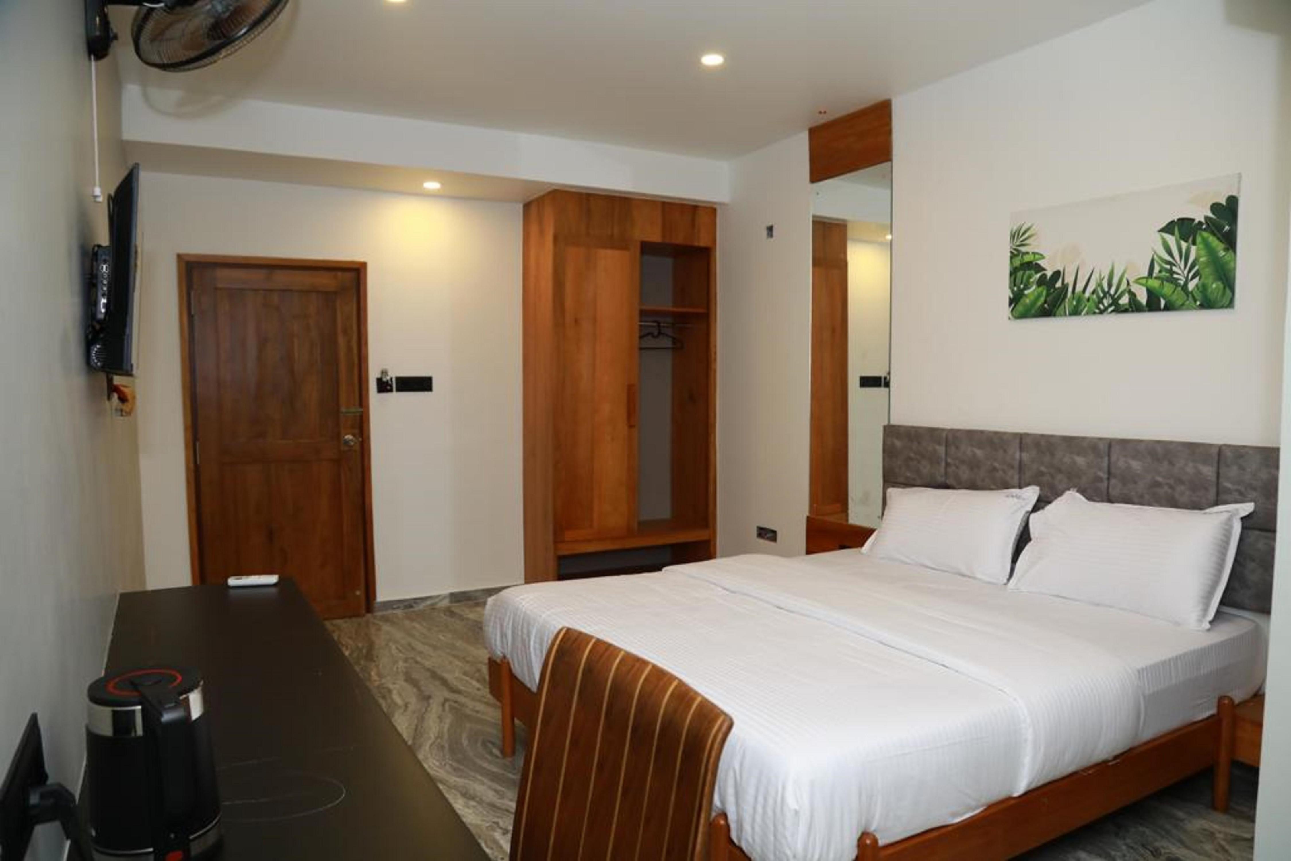 Luxe Inn Kannur - Tap to explore photos