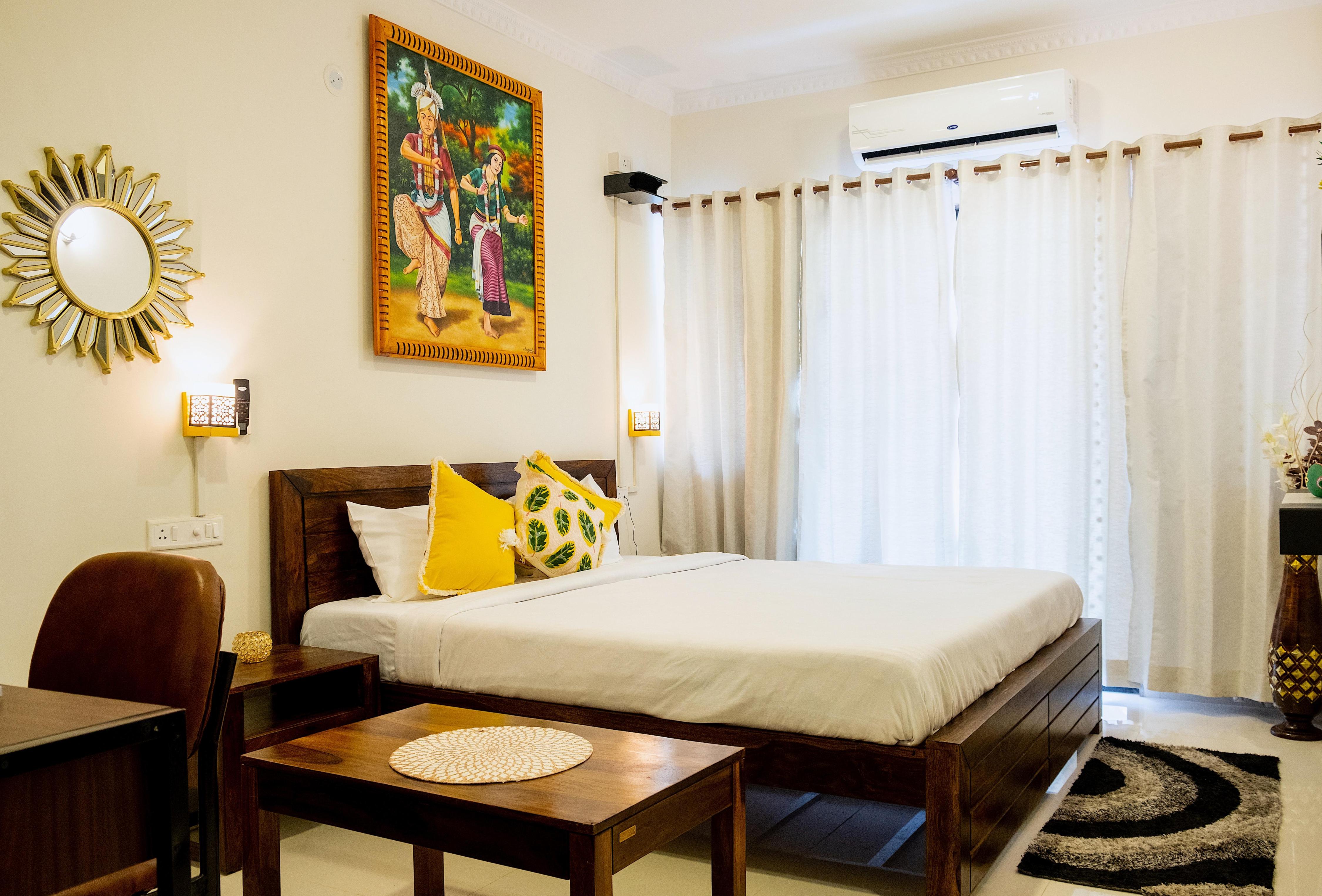 Comfortable studio room at candolim with free wifi pool and parking - Tap to explore photos