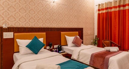 The Lodgers Hotel & Banquet Sector 38 Room Type - Deluxe Studio with twin Bed and Balcony