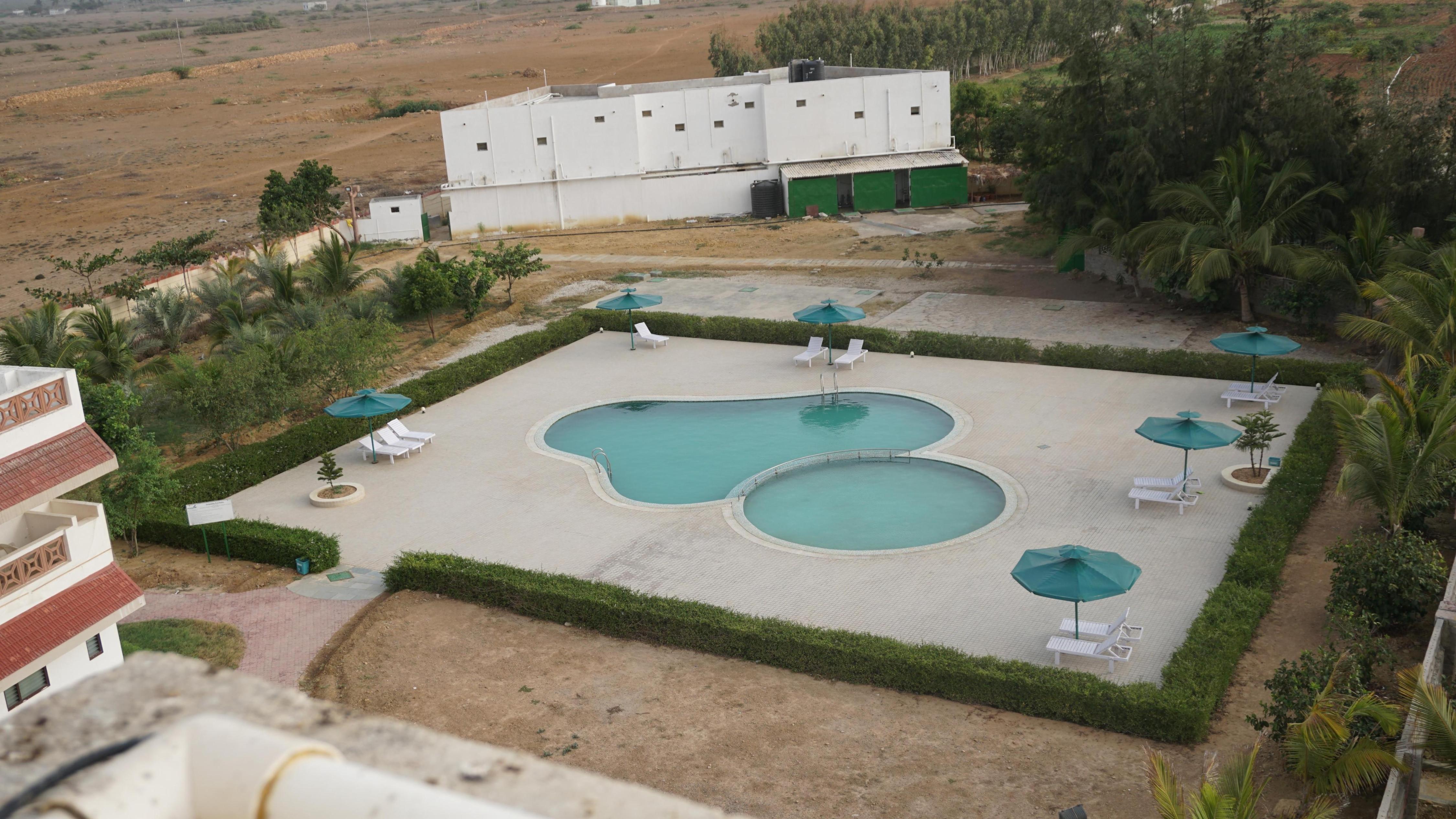 'Goverdhan Villa powered by Goverdhan Greens - Tap to explore photos
