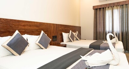HOTEL ELITE Room Type - Deluxe Four Bed AC