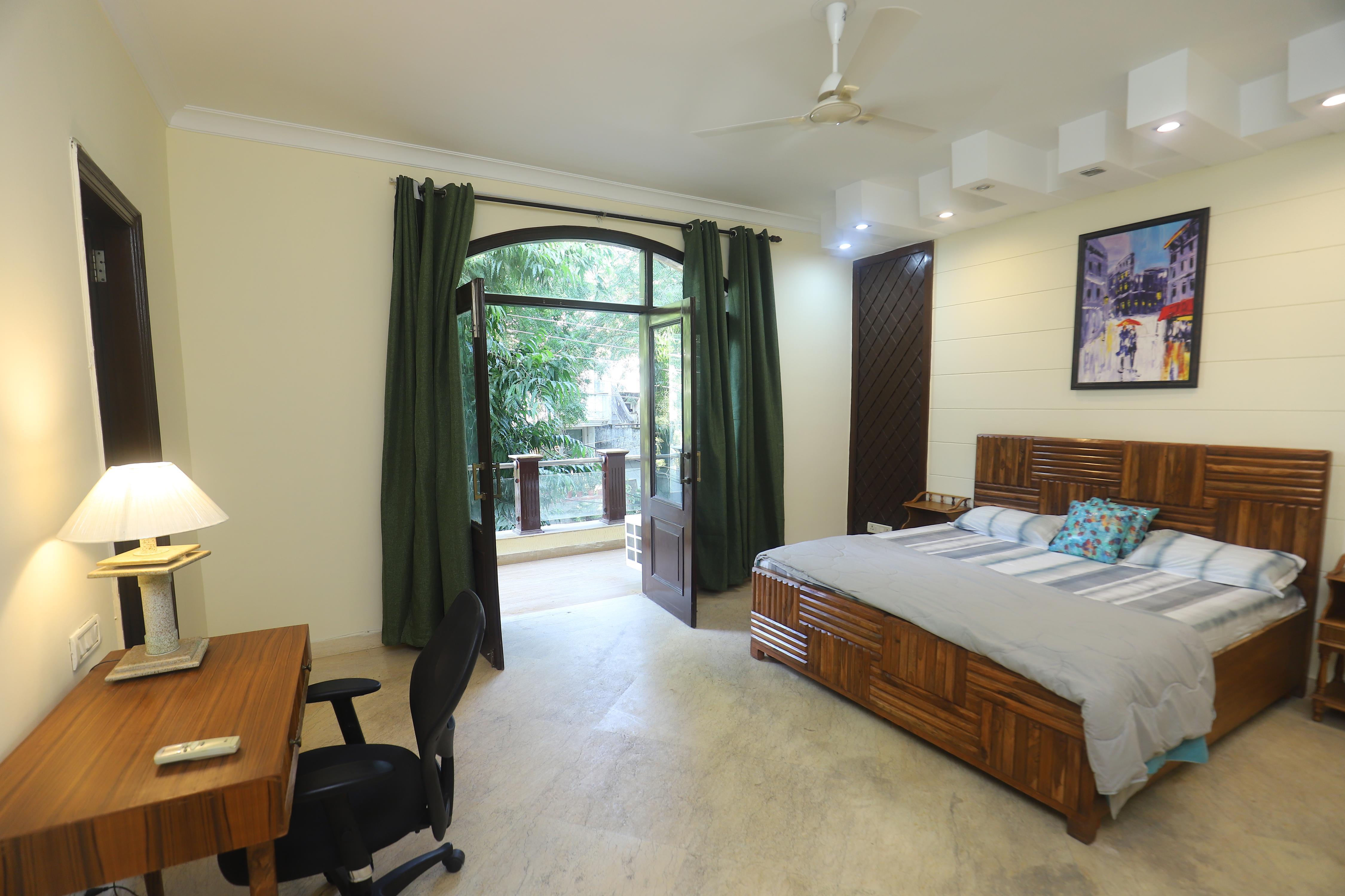 Sliceinn Orchid Room Type - Master bedroom with attached bathroom and unattached balcony - 101
