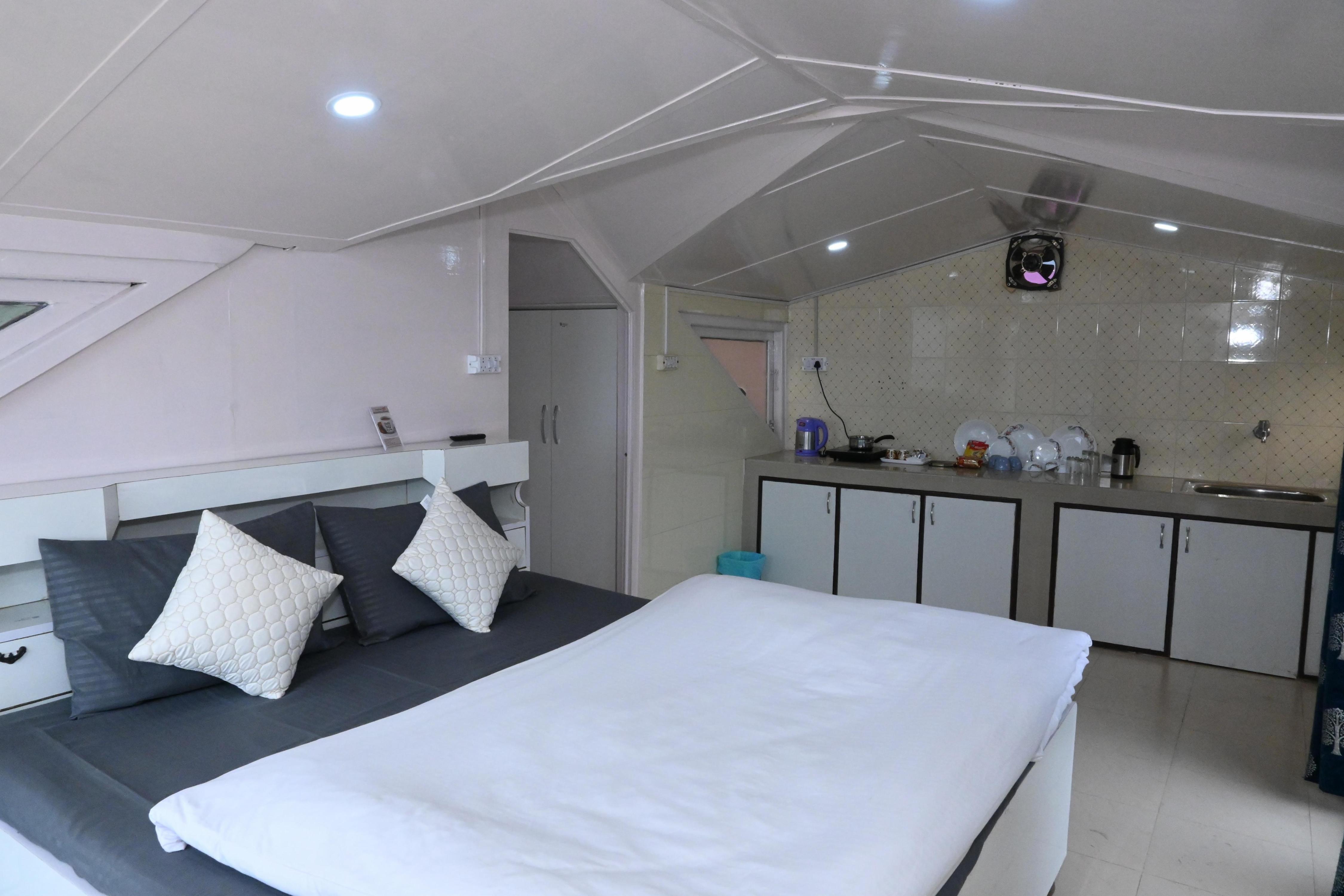 OM Niwas Room Type - Premium Attic Room with Terrace & Kitchenette