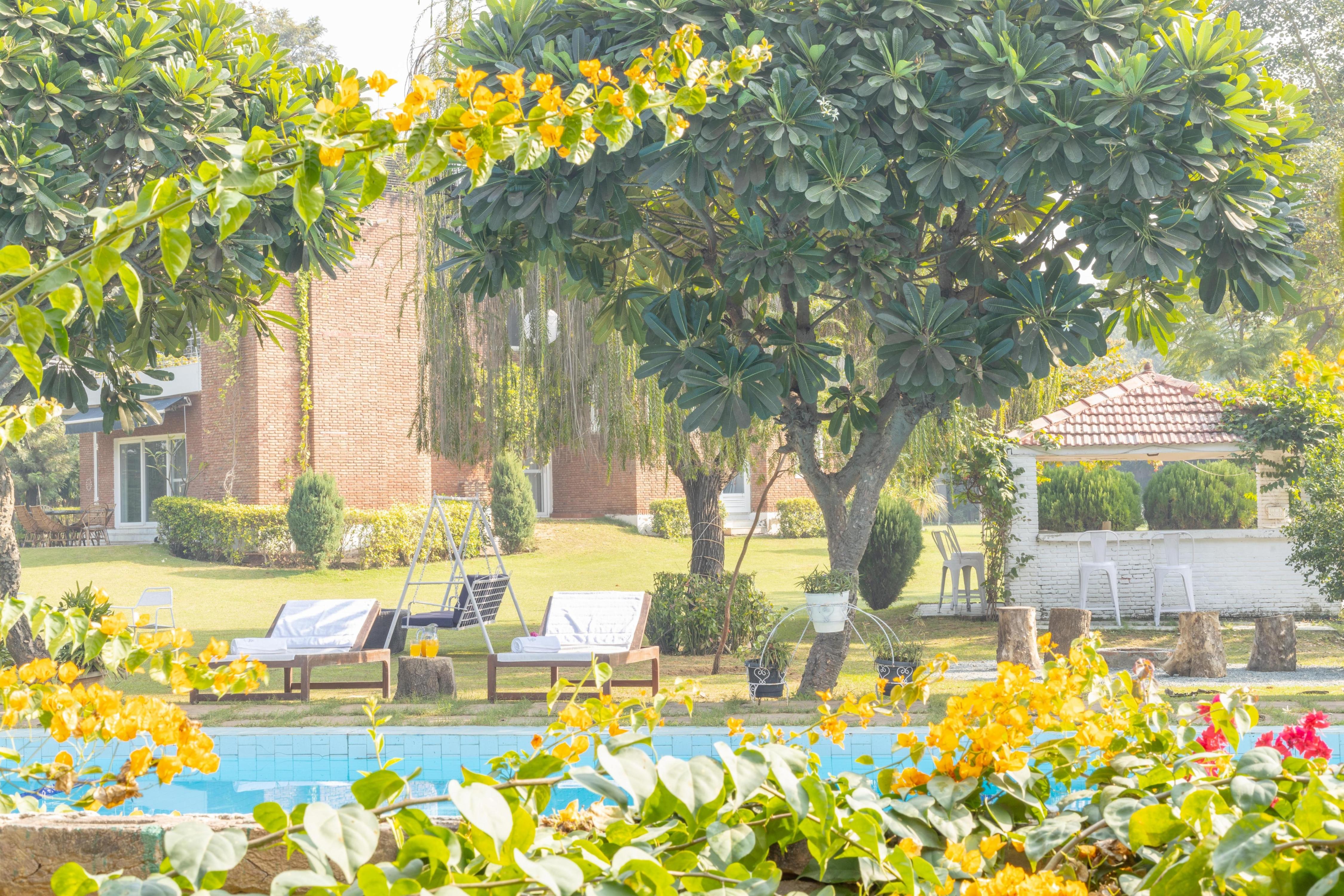 Hostie Humming Trees 4BHK Farmhouse Sohna - Tap to explore photos
