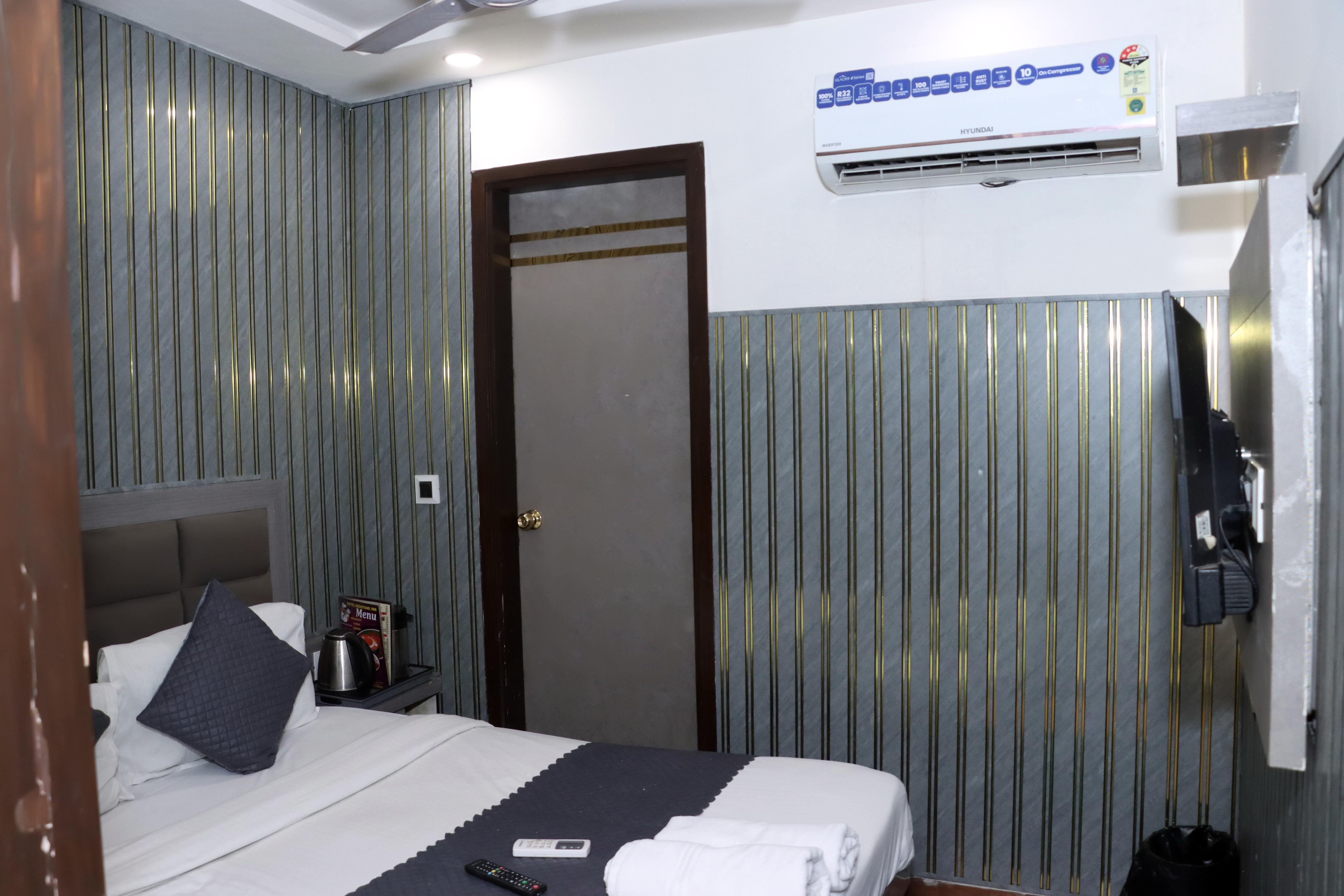 HOTEL RED STONE INN Room Type - Deluxe Room Non AC Complementary Wifi