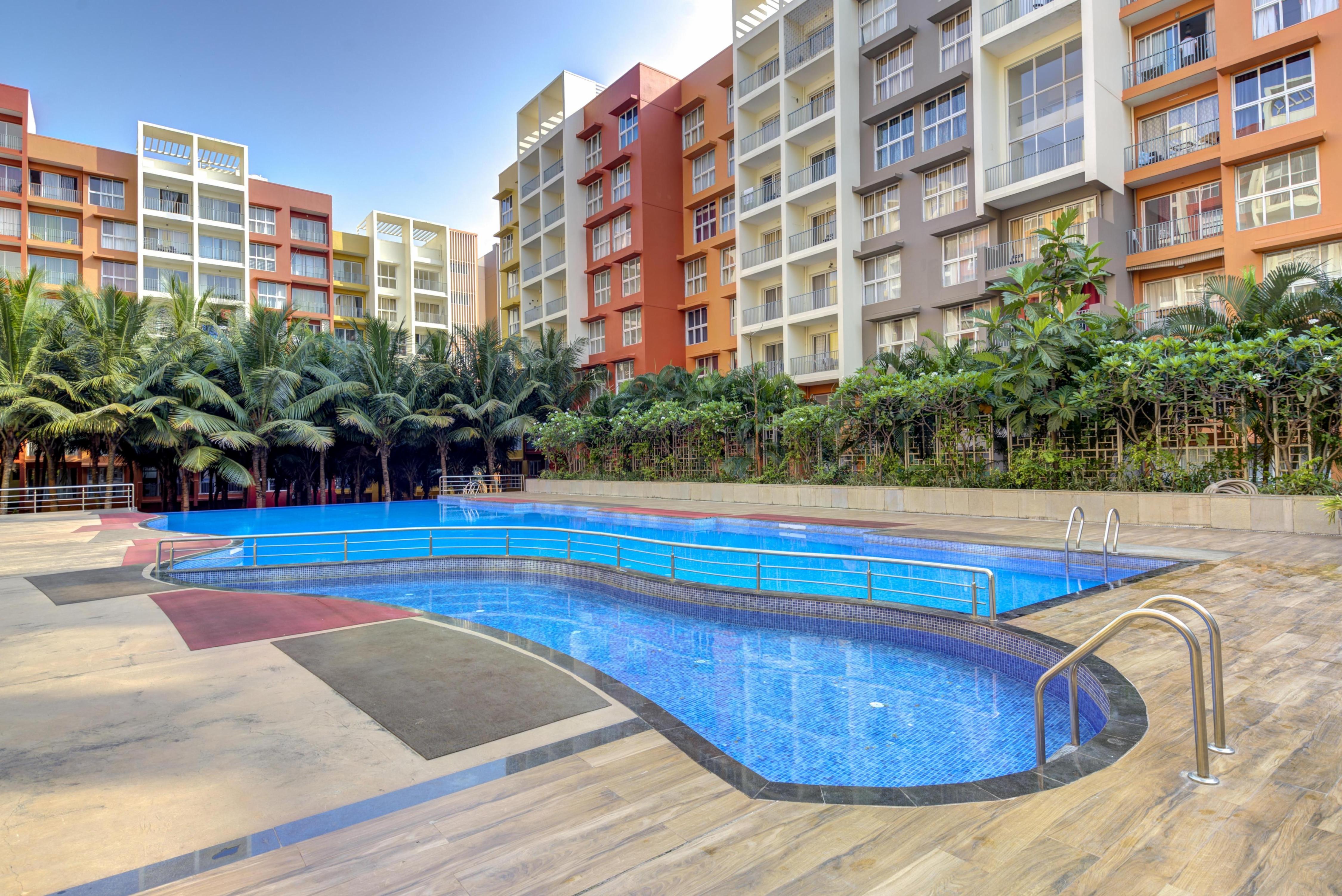 Coral BnB Luxe 2 BHK | 2 km to BITS | Pool Access - Tap to explore photos