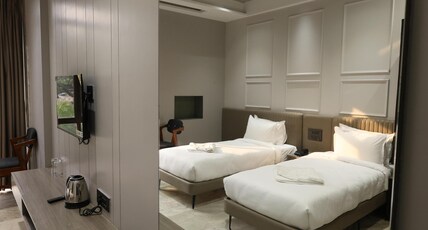 Hotel StatusInn Room Type - Deluxe AC Room With Twin Bed