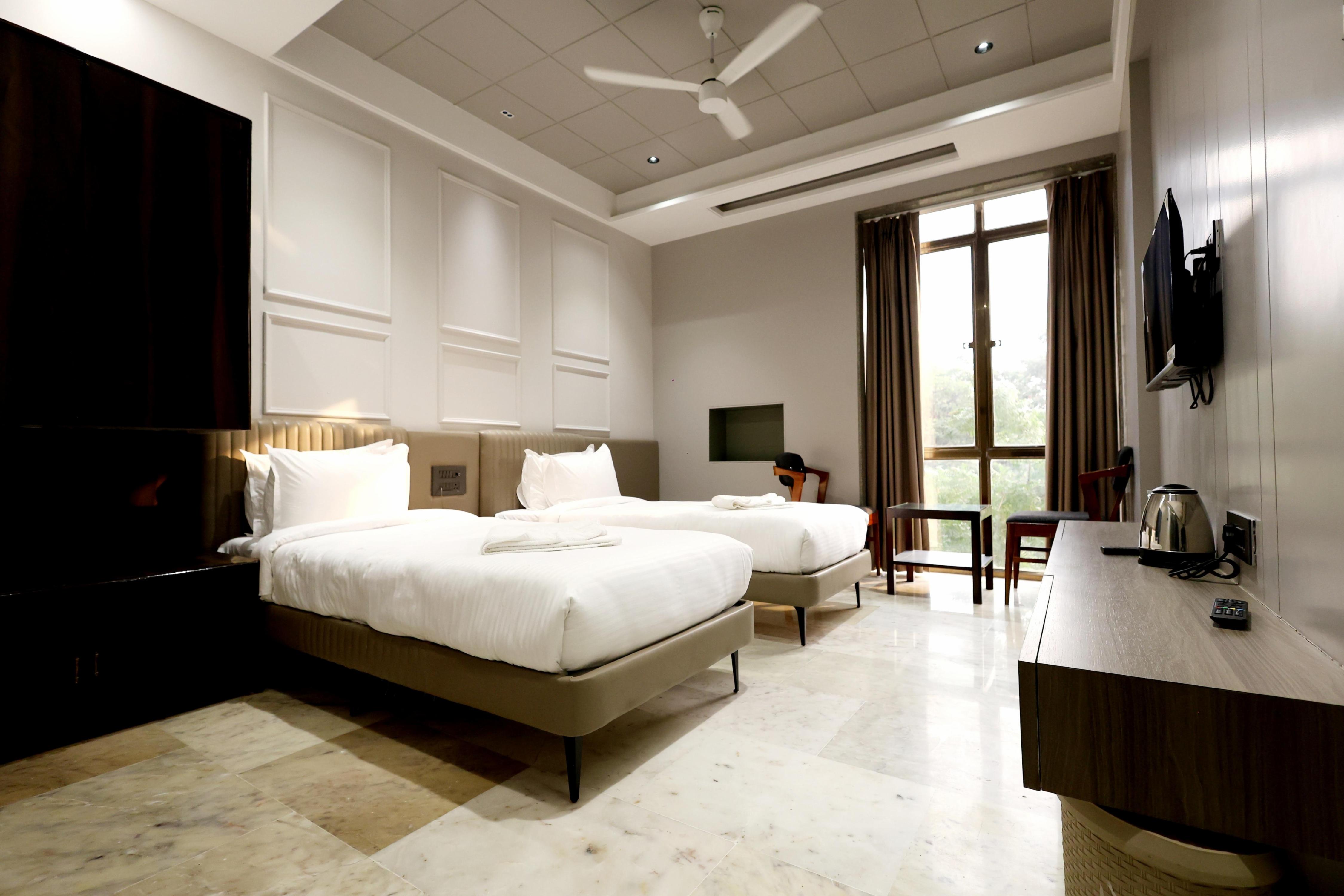 Hotel StatusInn Room Type - Deluxe AC Room With Twin Bed