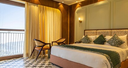 The Nathuli Manor | Pure Veg Stay | Near Mall Road with Free Parking & Shuttle Room Type - Premium room (Valley view with French Balcony) The Nathuli Manor | Pure Veg Stay | Near Mall Road with Free Parking & Shuttle Room Type - Premium room (Valley view with French Balcony)