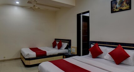 Hotel Sai Vishwkarma Room Type - Family Four Bed Room. NON A.C. with 2 King-size Bed Hotel Sai Vishwkarma Room Type - Family Four Bed Room. NON A.C. with 2 King-size Bed