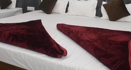 HOTEL OM RATN Room Type - DELUX FAMILY 8 BEDED AC ROOM