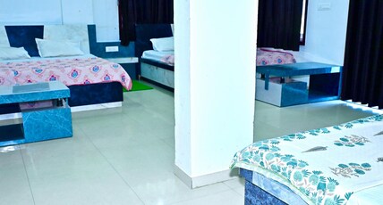 Hotel Radha Palace (400 meters from Khatu Shyam Mandir) Room Type - Family Room (3 Double Bed) Hotel Radha Palace (400 meters from Khatu Shyam Mandir) Room Type - Family Room (3 Double Bed)
