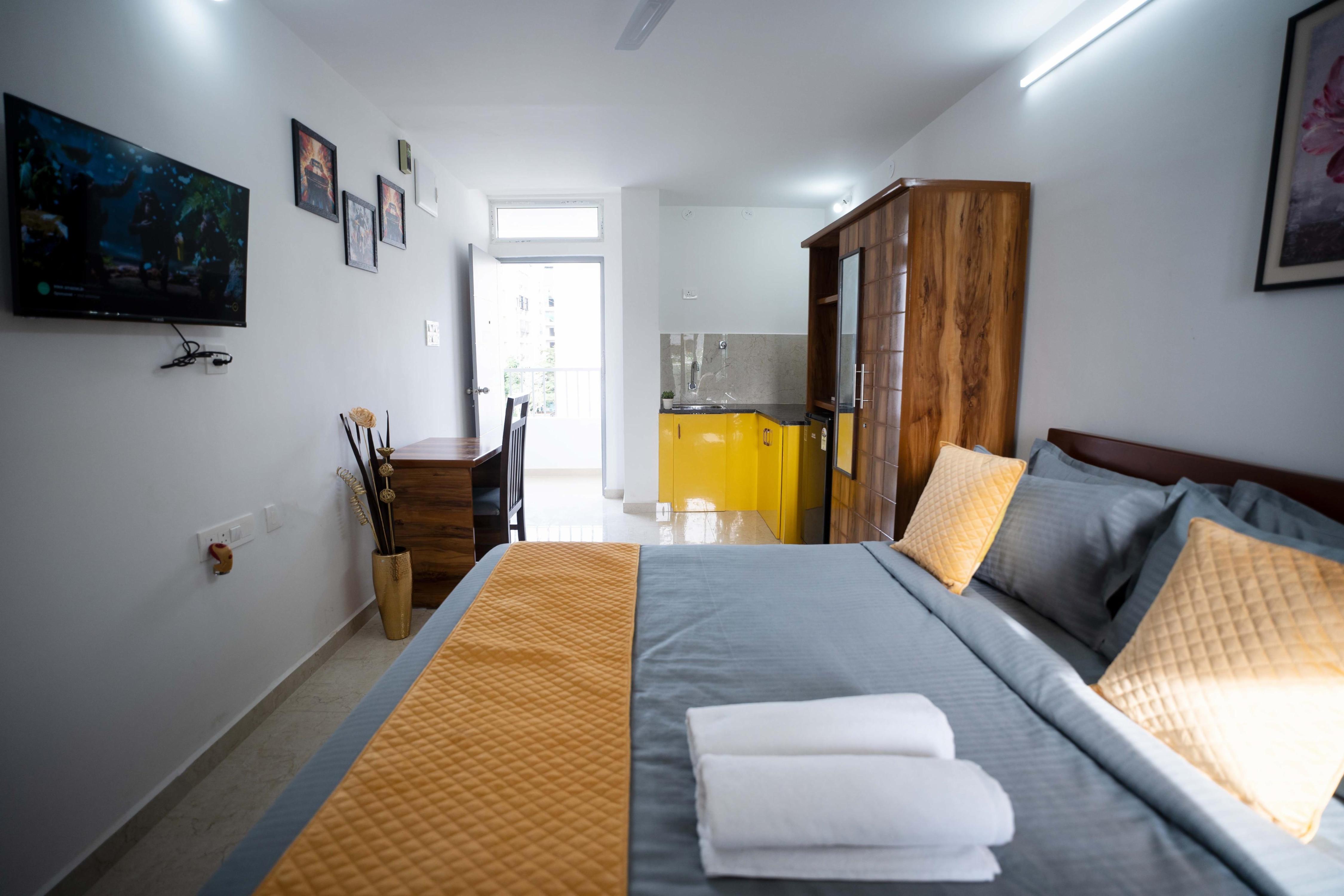 Yellow Bells Studios And Suites - Tap to explore photos