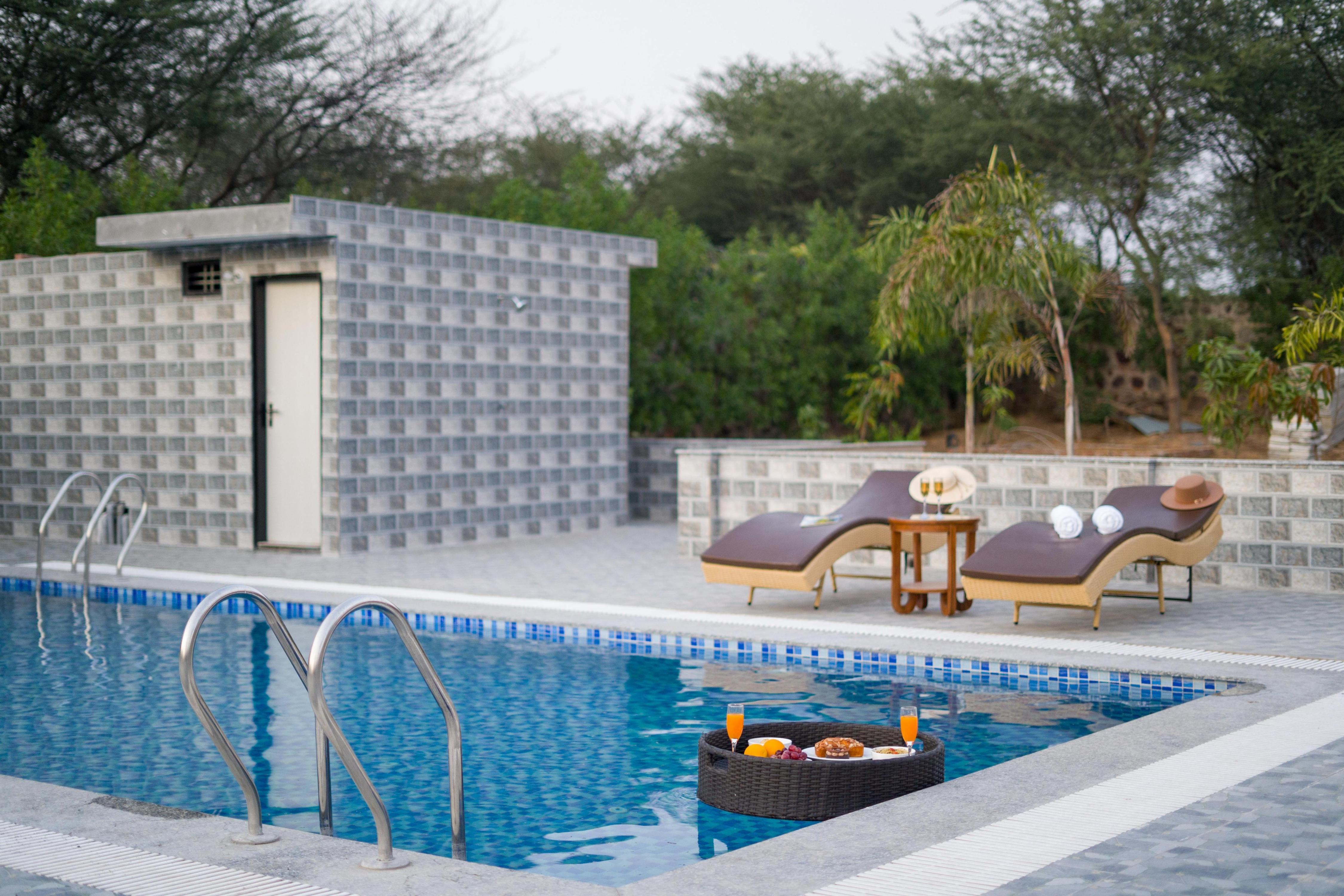 ELIVAAS Signature 5 BHK With Pvt Pool & Garden | Zenora - Tap to explore photos