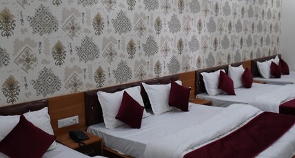 Hotel Santosh Palace (Free Gated Parking & 10 Minutes walk from Temple) Room Type - Grand Family Room for 8 Pax - 4 King Beds with 2 Bathrooms