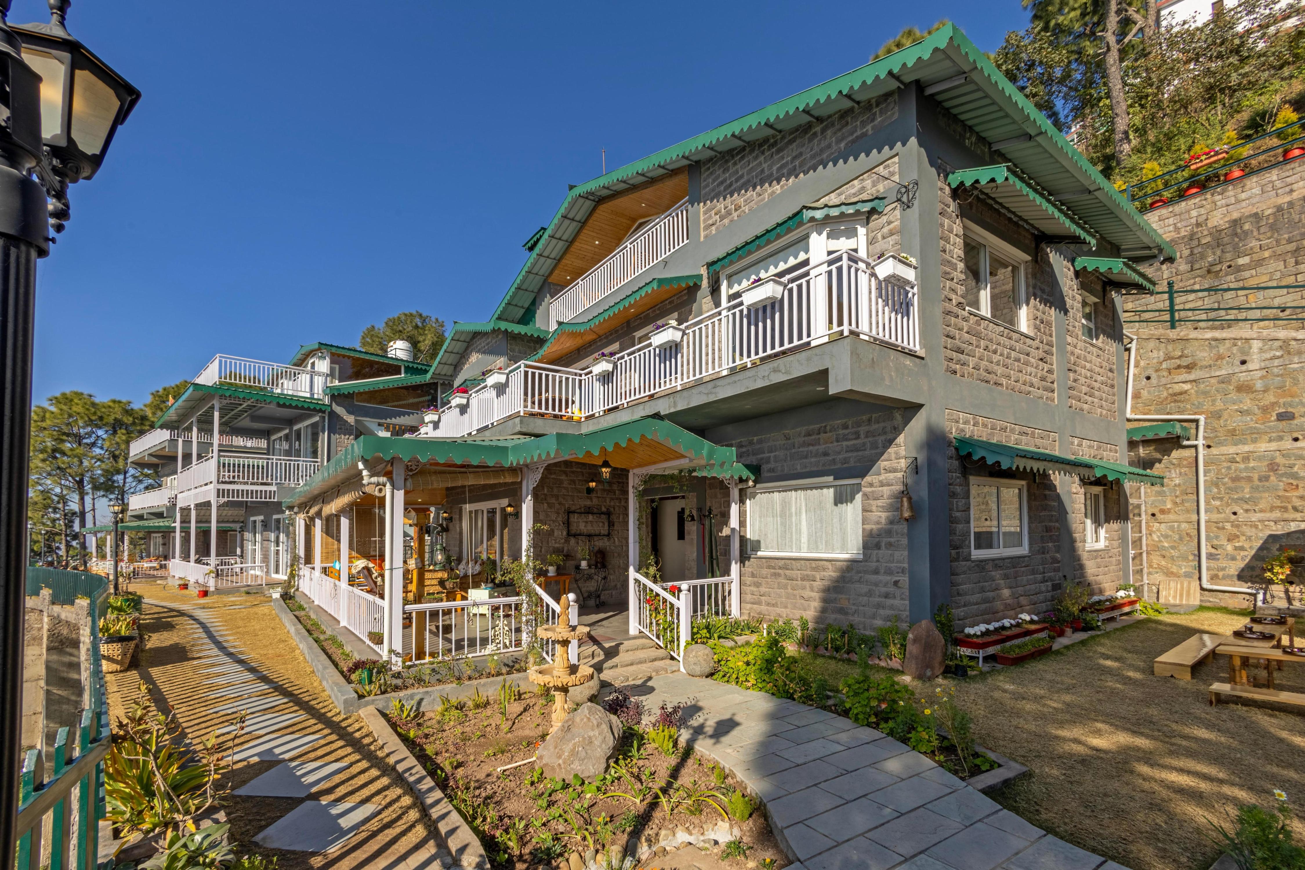 ELIVAAS 4BHK with Attic Cliffside Villa with Scenic Views