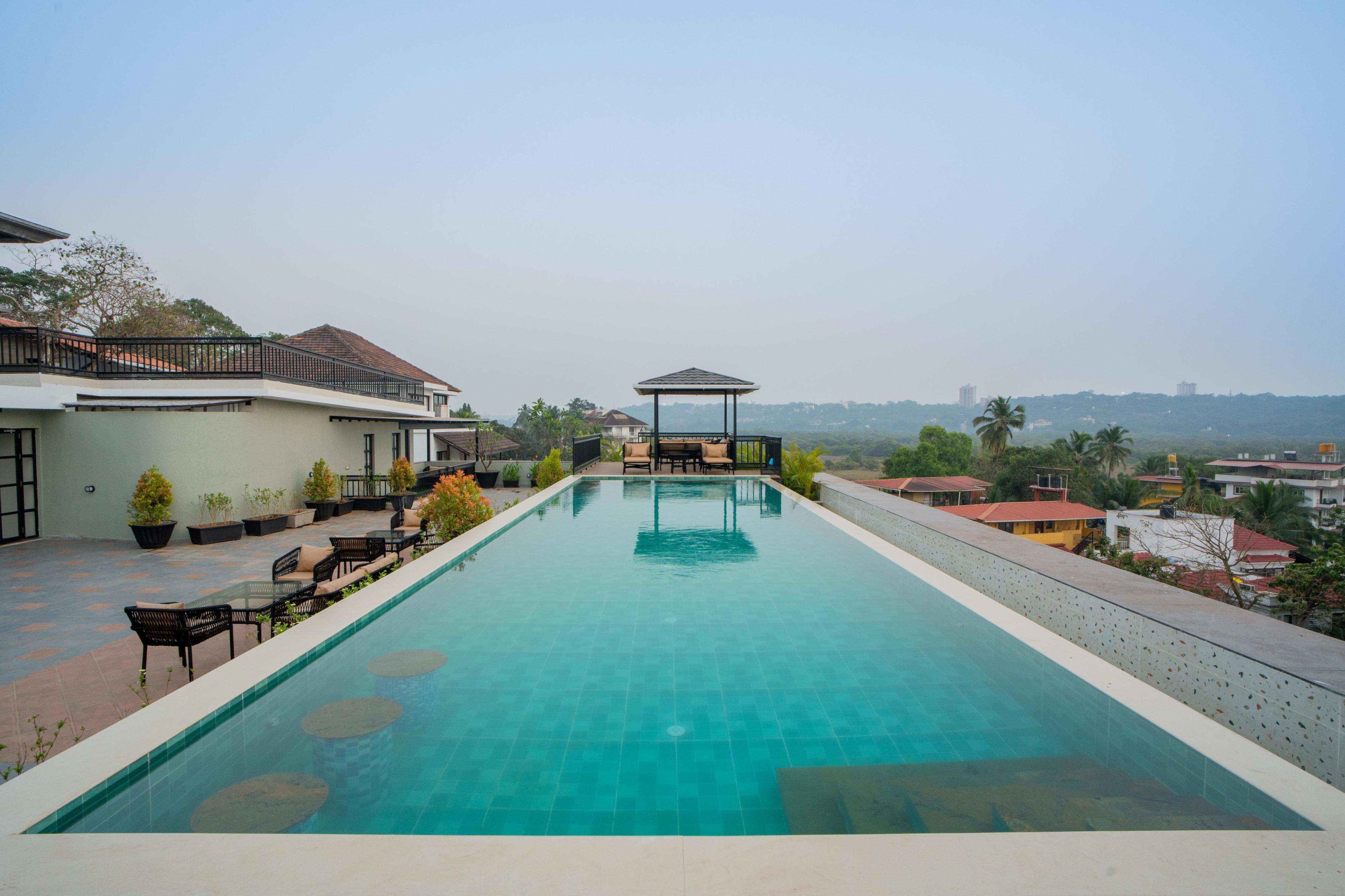 ELIVAAS Signature Kamerios Skye 1 BHK Luxury Apt.with Rooftop Pool - Tap to explore photos