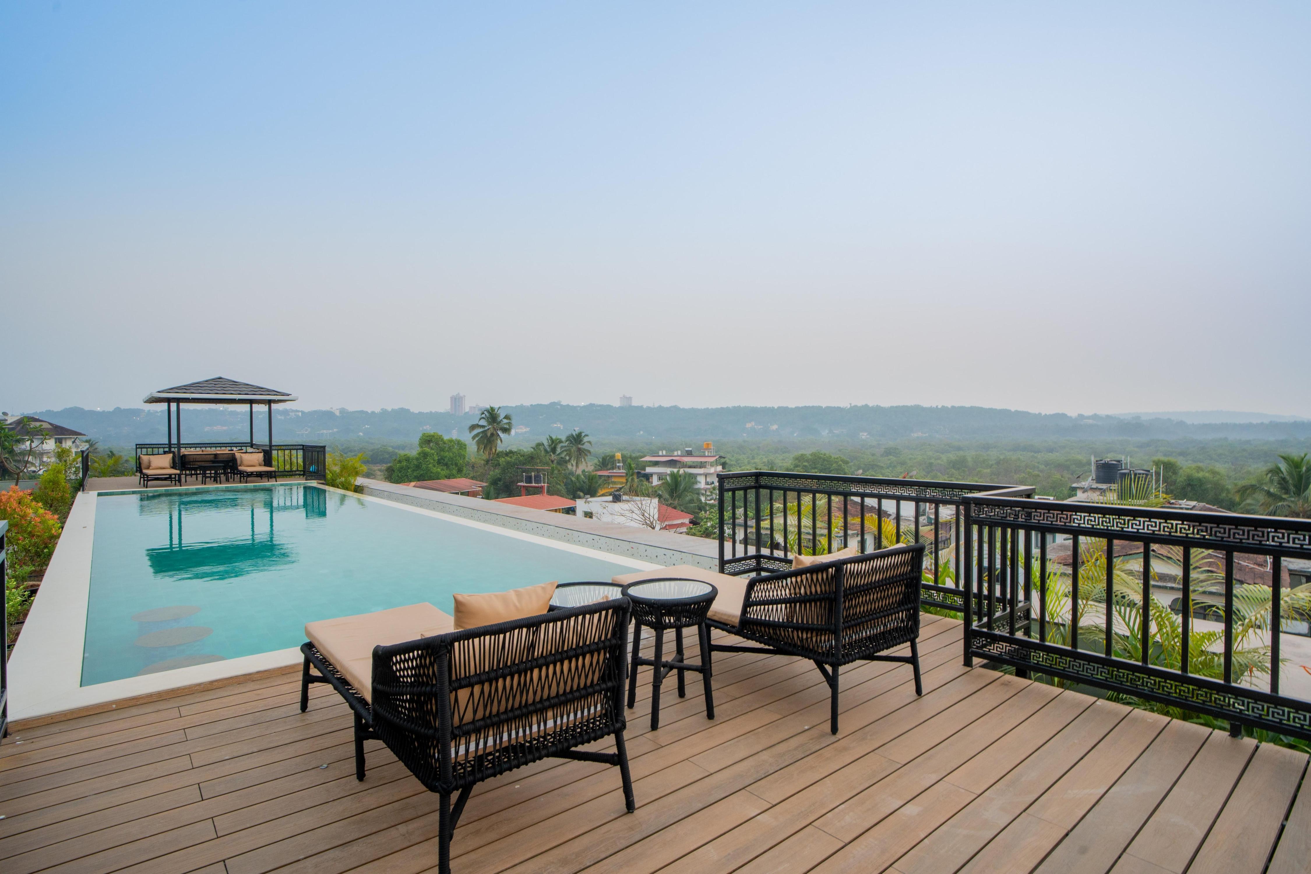 ELIVAAS Signature Kamerios Skye 1 BHK Luxury Apt.with Rooftop Pool - Tap to explore photos