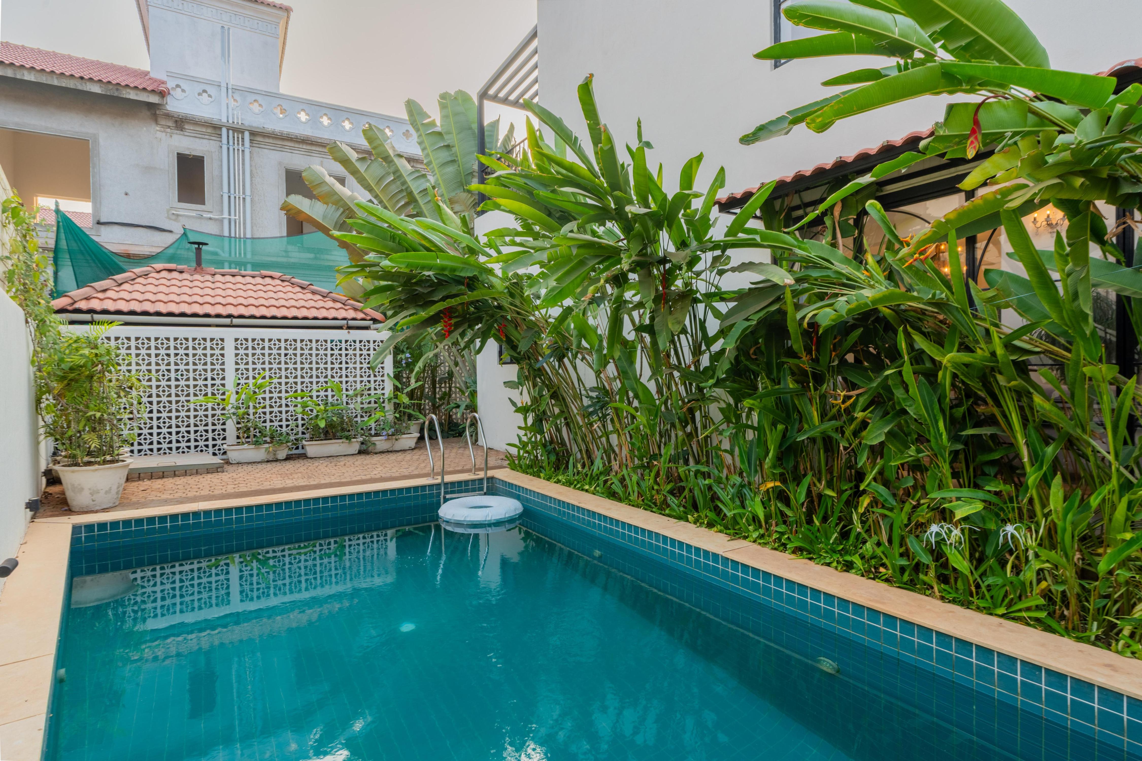 ELIVAAS Signature Bogenvilla Luxe 3 BHK Villa Near Ozran Beach - Tap to explore photos