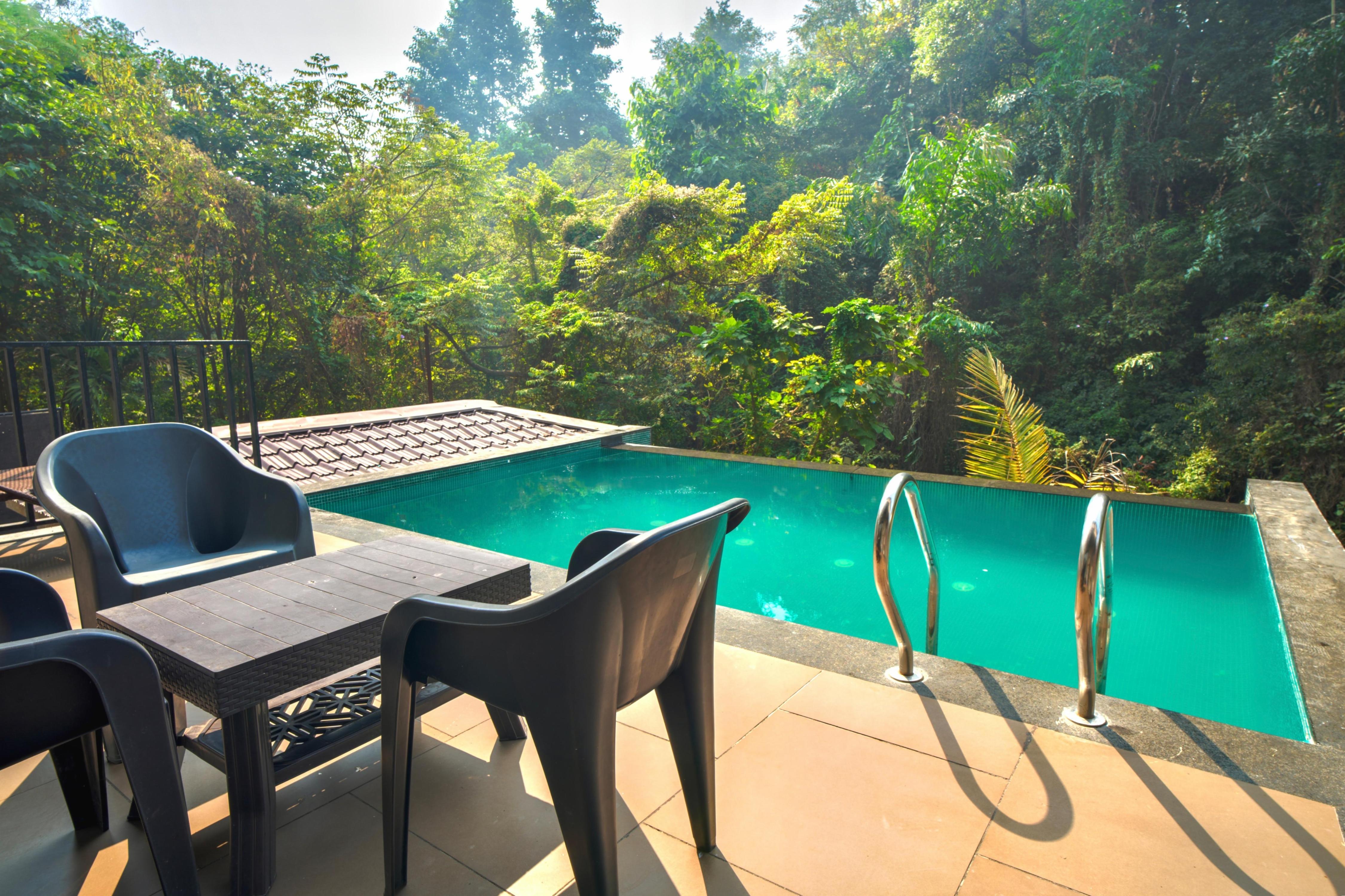 FernWood 4BHK with Infinity Pool by TensorStays - Tap to explore photos