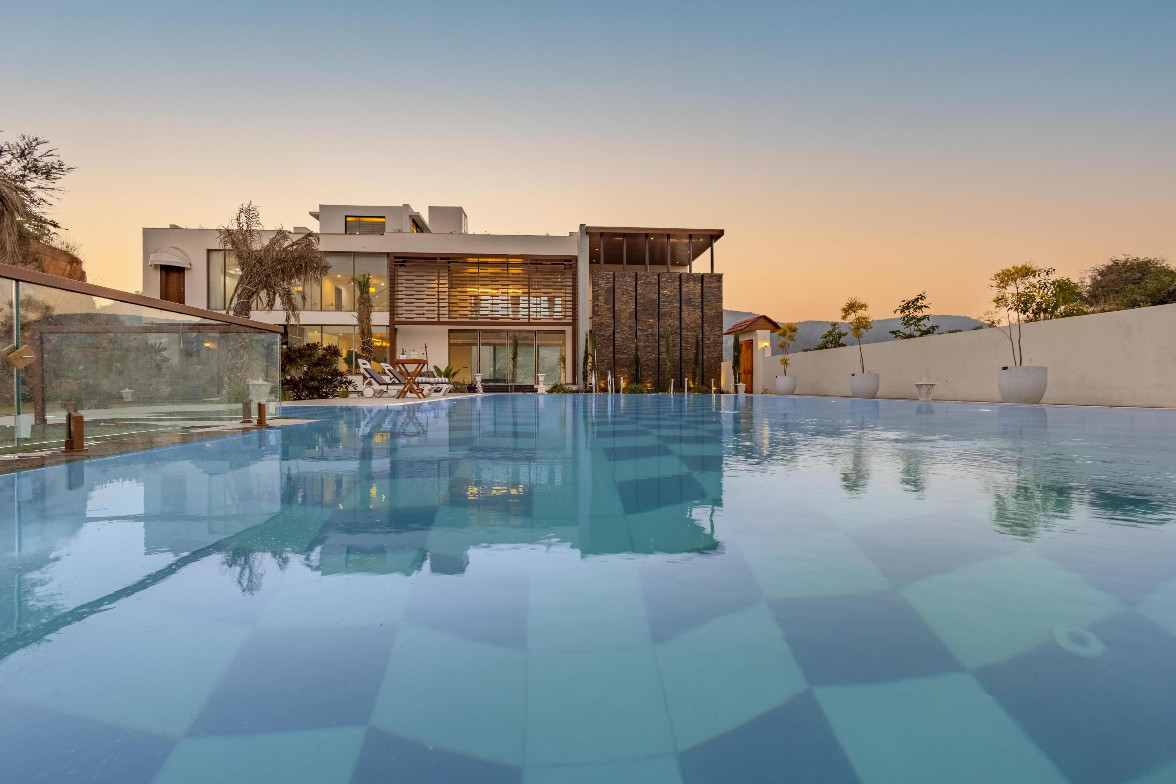 Elegant 5 BHK Villa with Private Movie Theatre & Pool - Tap to explore photos