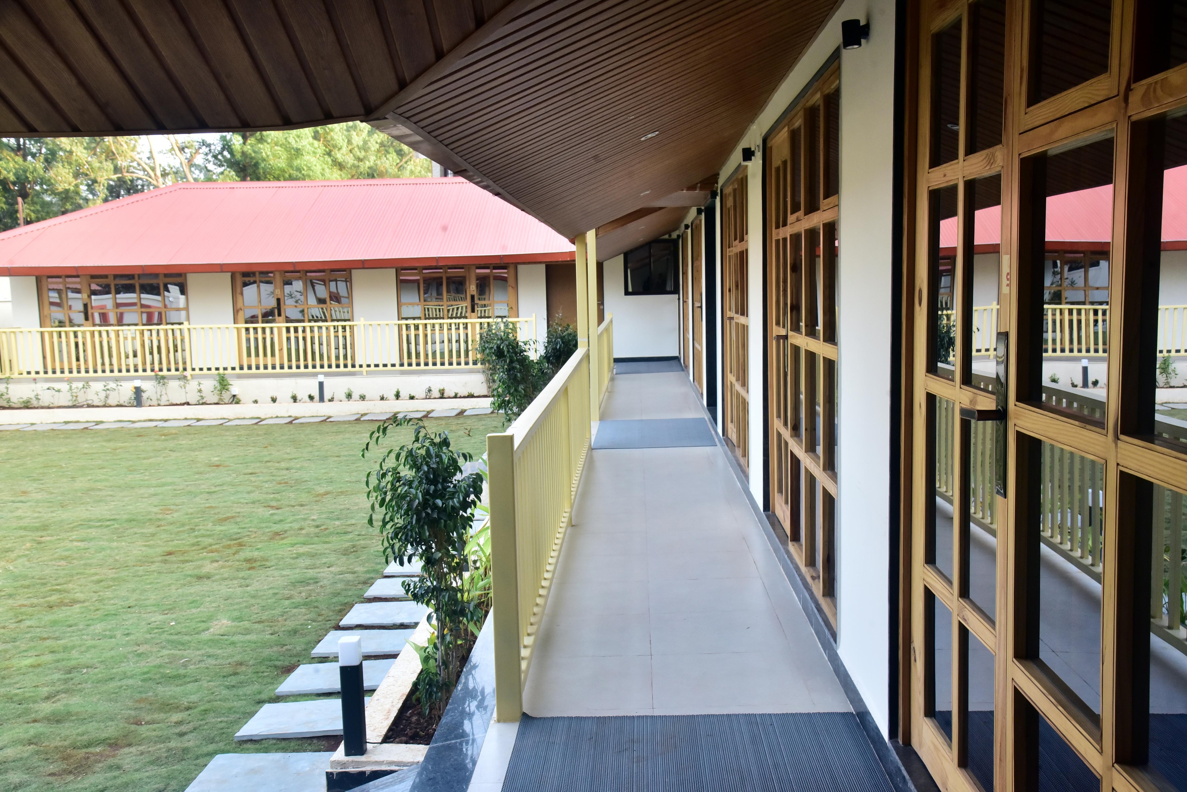Red Soil Panchgani Room Type - Deluxe Room with Balcony and Garden Sitout Red Soil Panchgani Room Type - Deluxe Room with Balcony and Garden Sitout