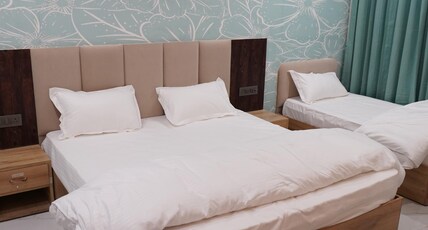 Hotel Heera Palace Room Type - Luxury Triple Room ( 1 Double Bed + 1 Single Bed )
