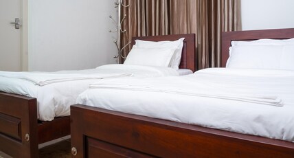 Muraleeravam AC Rooms in a Villa Room Type - Bedroom 1