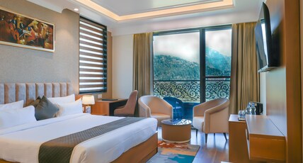 Alivaa Hotel, McLeodganj  Best Dhauladhar View | Infinity Pool & Sky Garden Room Type - Deluxe King Room with Balcony