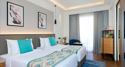 Iris Sarovar Portico Room Type - Deluxe Room with Balcony - 2 Twin Beds