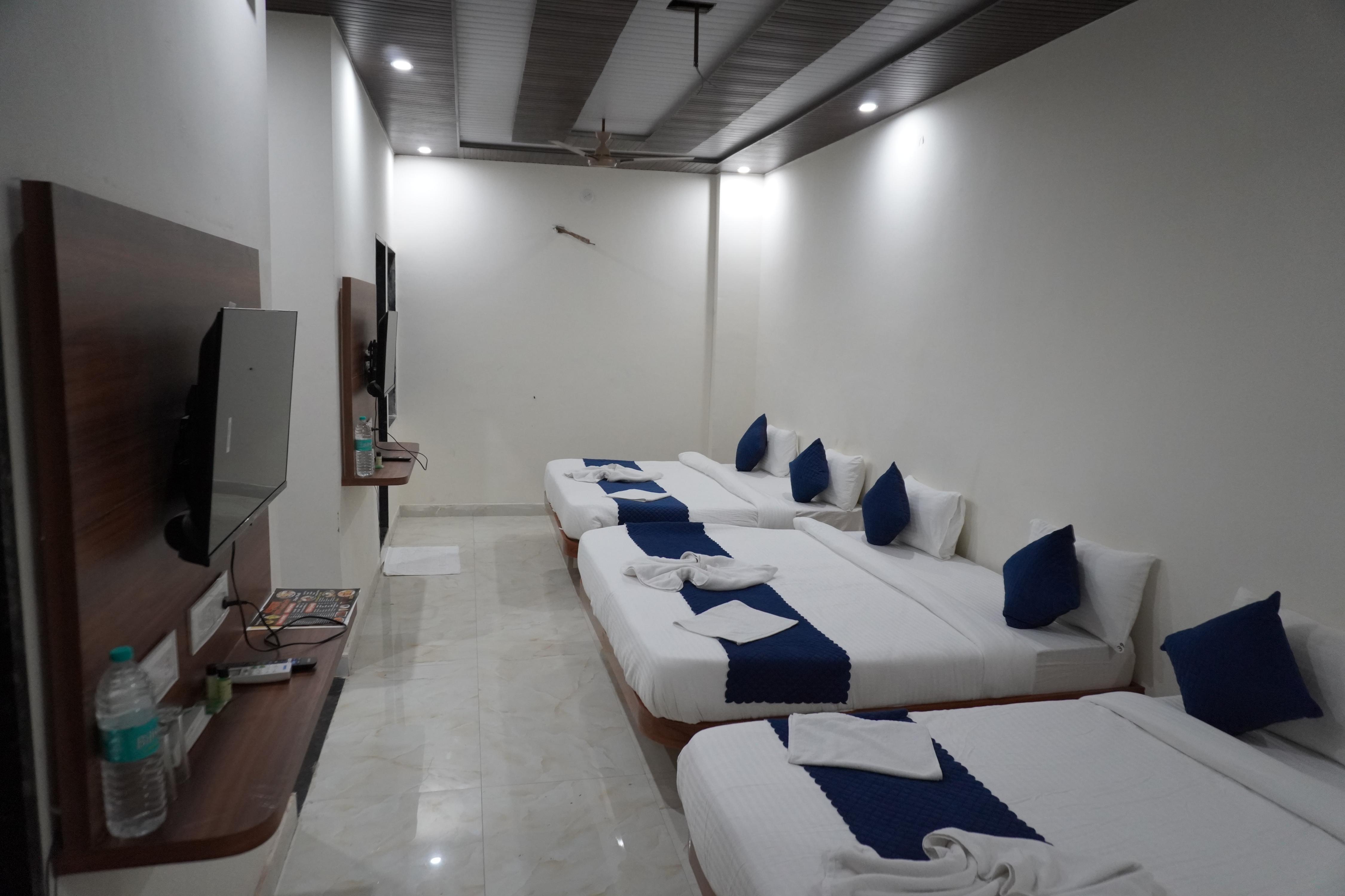 Hotel Tushar Palace - Tap to explore photos