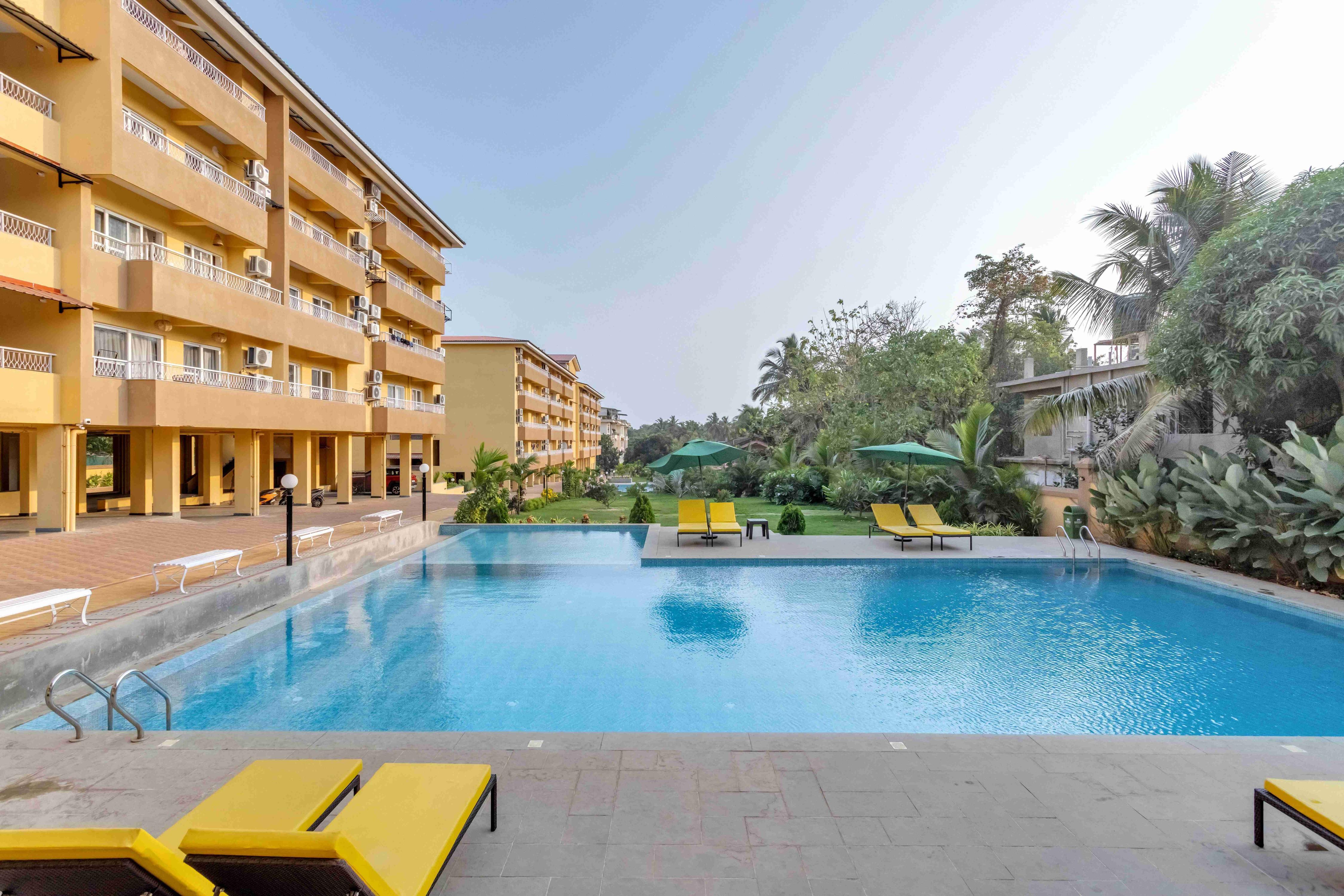 tisyastays | Samaara 2BHK Apartment with Pool & Gym , Close to beach - Tap to explore photos