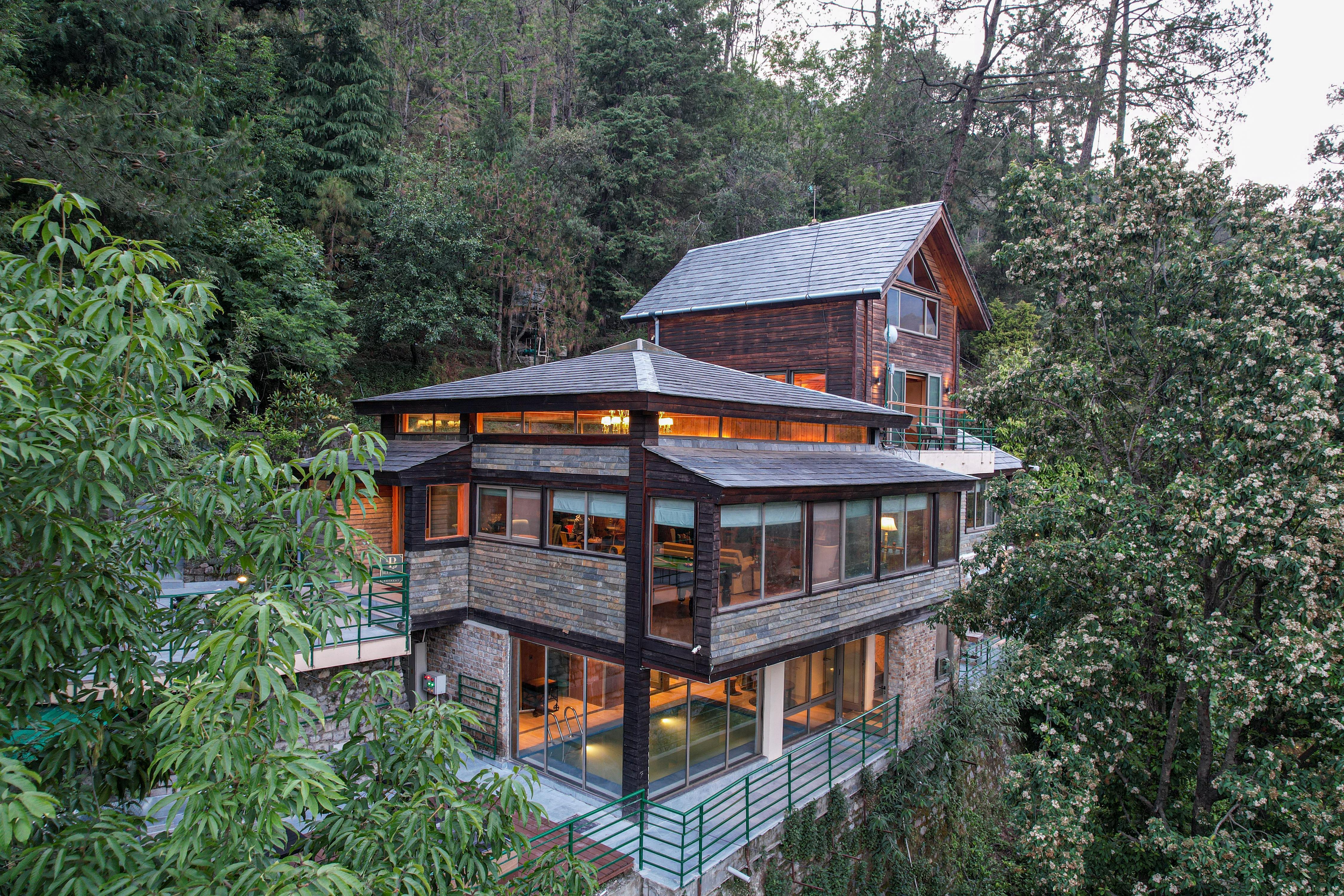 ELIVAAS Blushing Pines Retreat Stunning 3-BHK Hillside Getaway with Attic & Indoor Pool