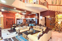 Wooden Whispers - A Luxe Traditional Spacez Villa with Private Theatre & Terrace