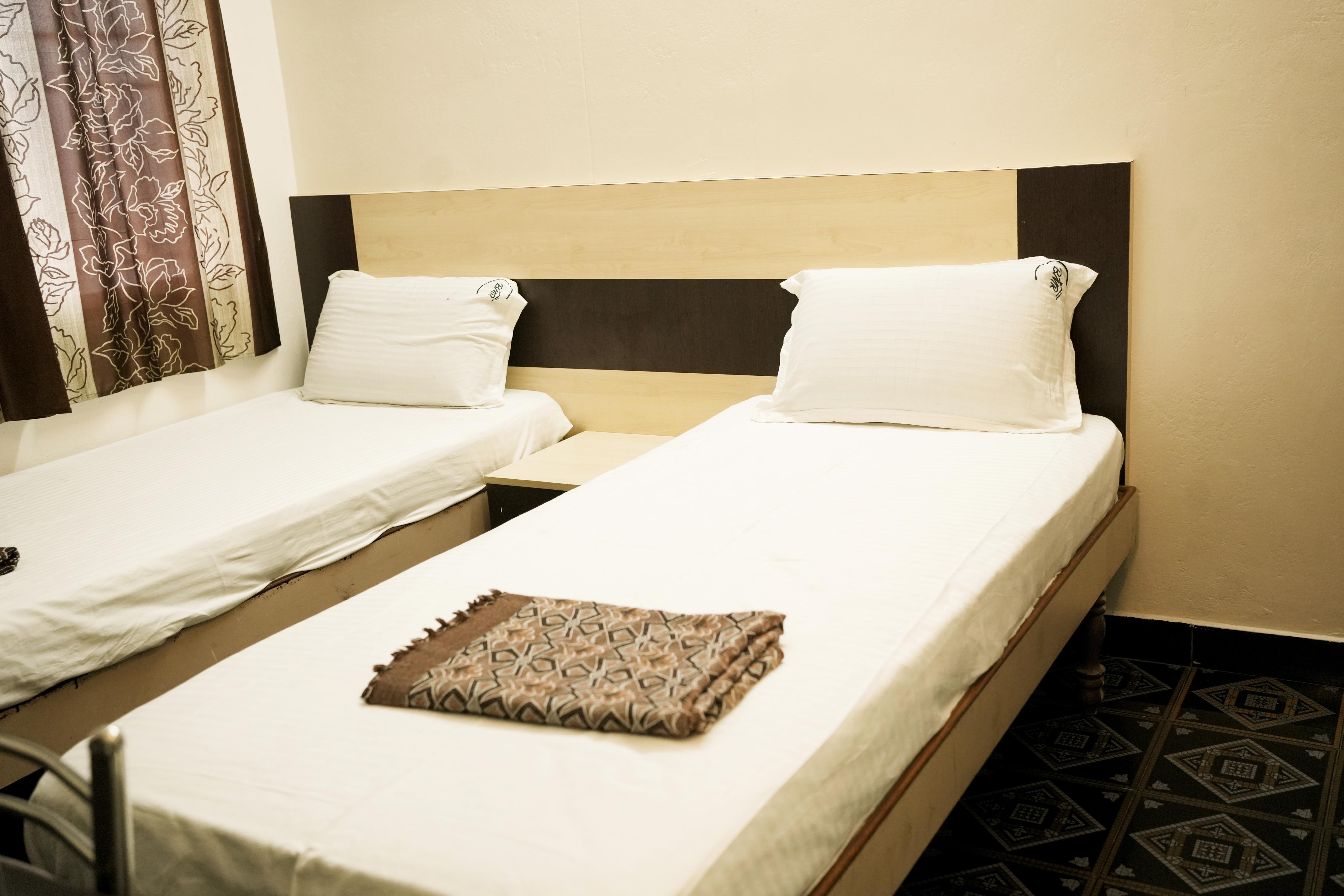 Hotel BMR Stay - Tap to explore photos