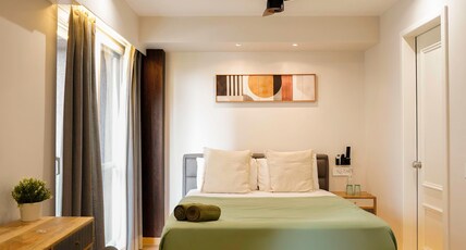 Luxora Stays | Beside Airport | Entire Apartments Room Type - B218|Airport view from roof|55 inch TV|Coffee Maker