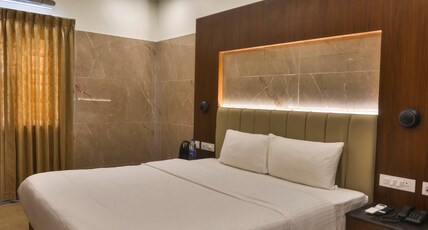 Arthana Residency Hotel Room Type - Deluxe Room