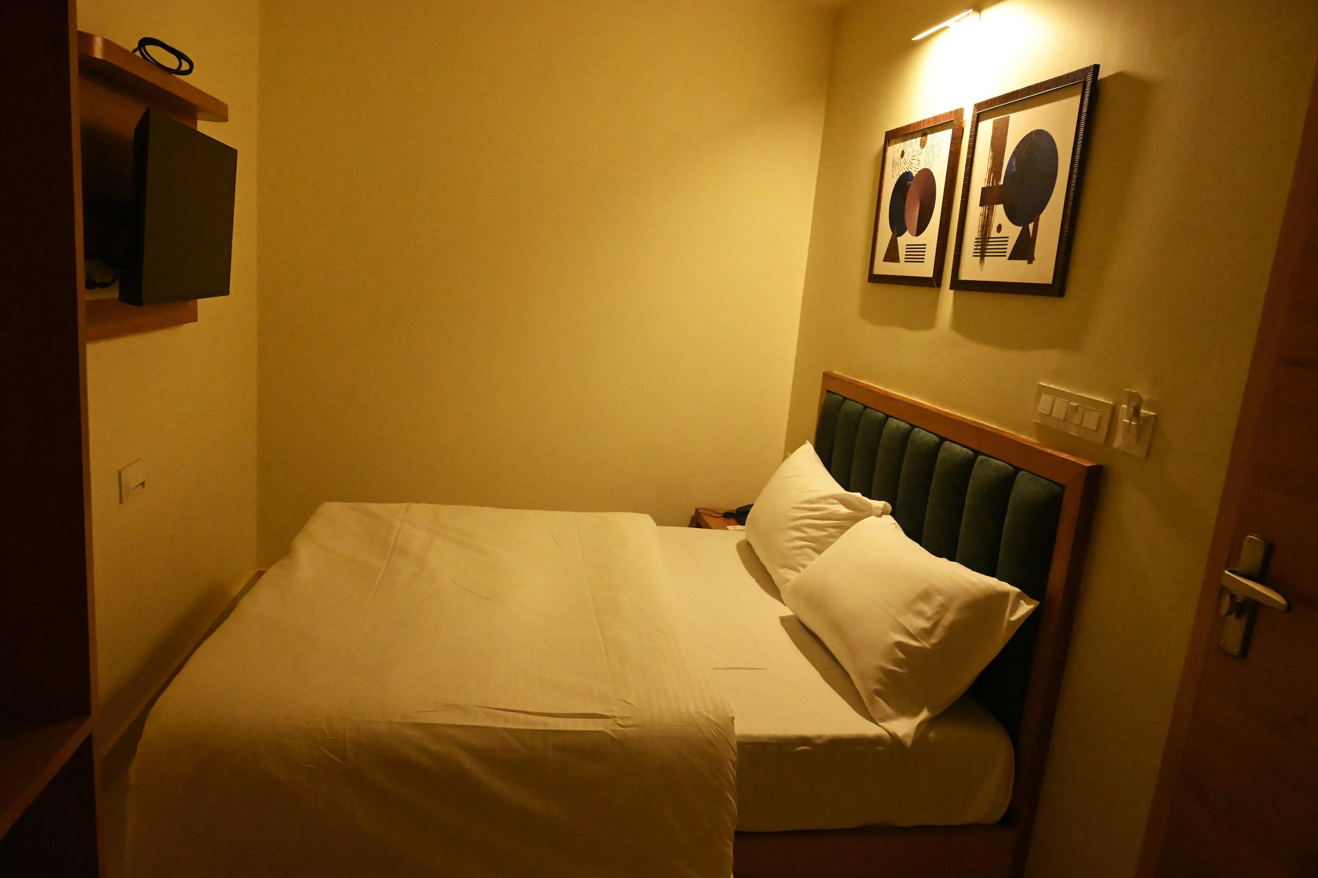 Hotel Om Elite Stay - Tap to explore photos