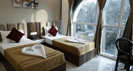 Hotel Raj Residency Room Type - Deluxe Twin Bed Room With City View