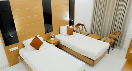 Paarijatham Residency Room Type - Premium Room Twin Bed
