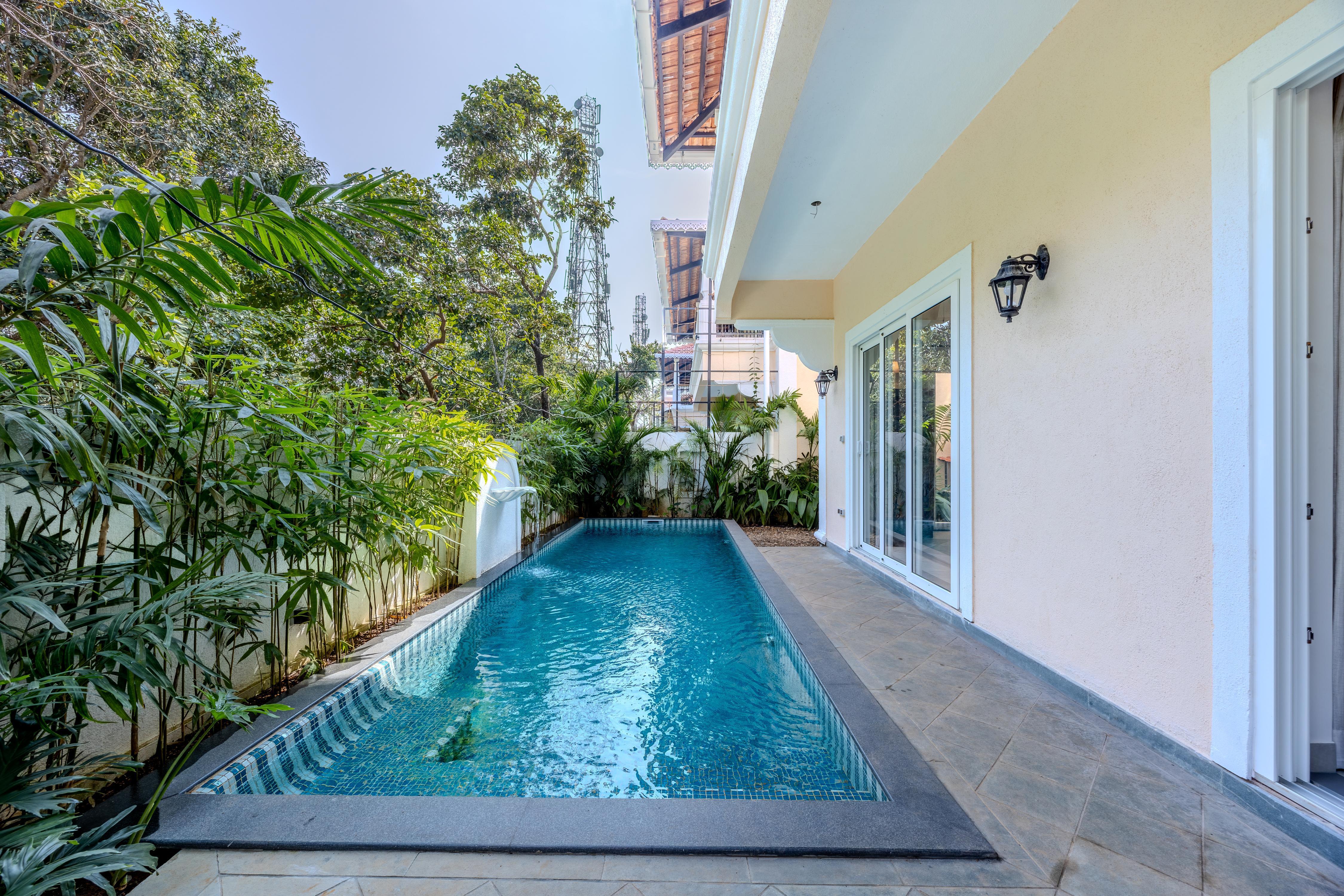 ELIVAAS Cygnus 4BHK With Pvt Pool - Tap to explore photos