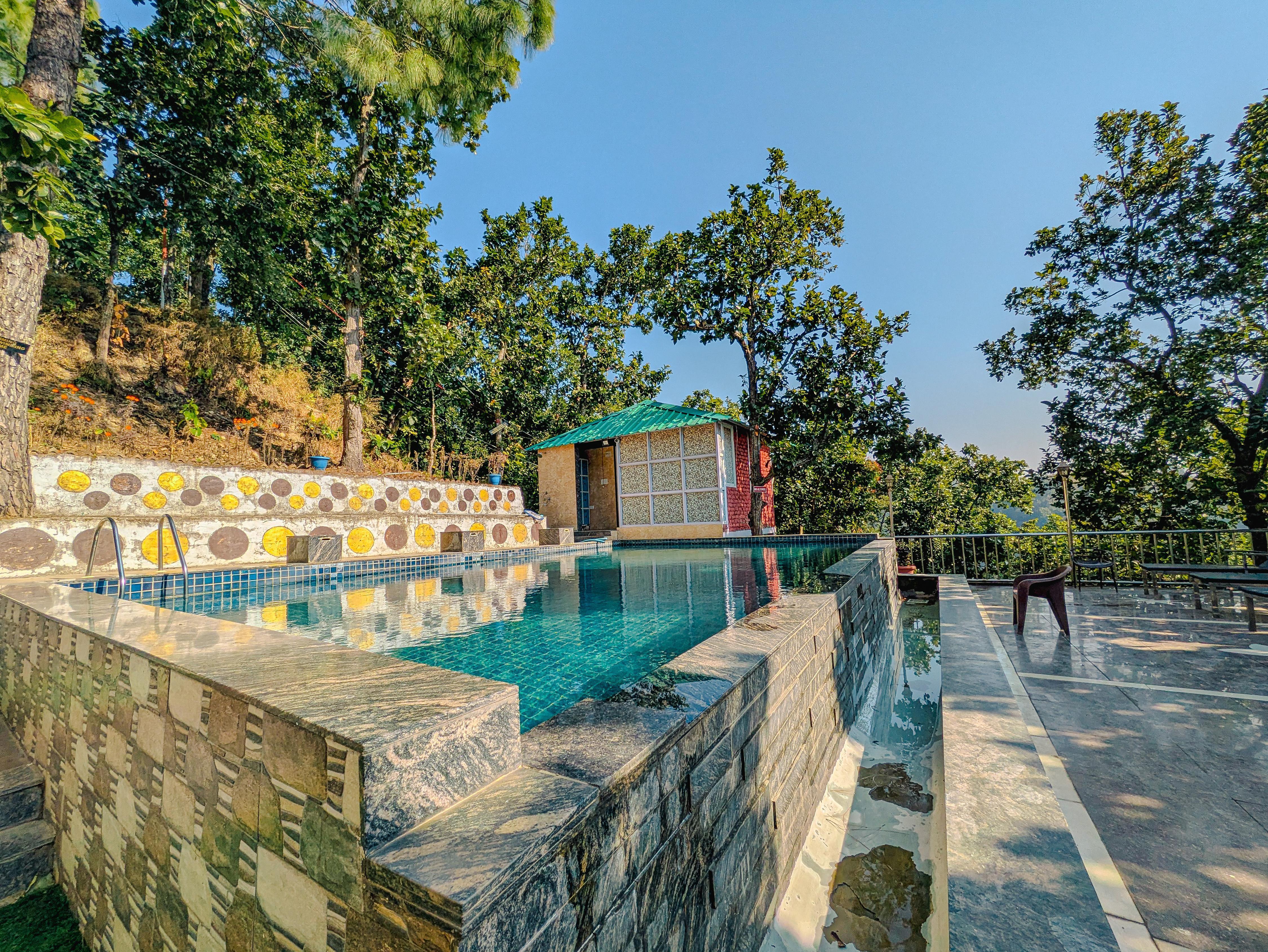 Woodscape Villa 2BHK with shared pool in Lansdowne by Homeyhuts - Tap to explore photos