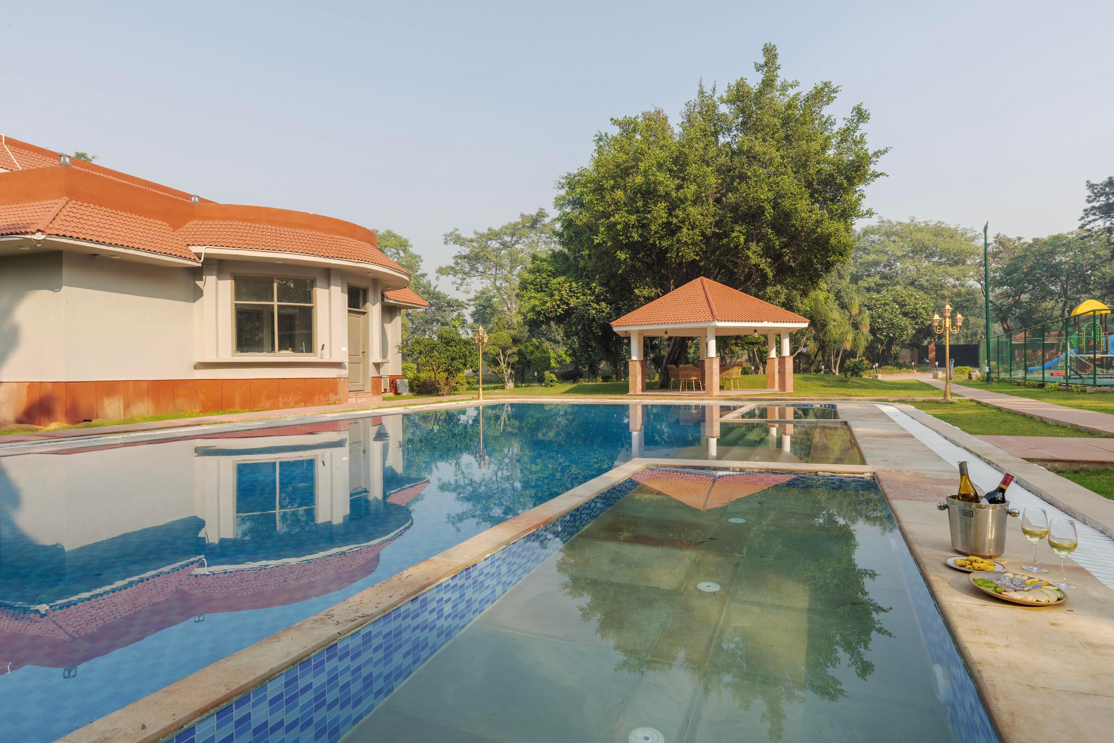 SaffronStays Emerald Farms - Tap to explore photos