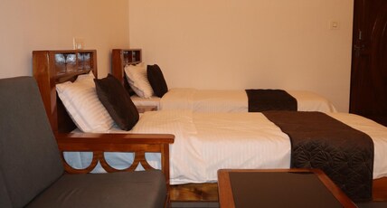 HOTEL TIBET (FTCI Cottages) Room Type - Deluxe room with twin bed, sit -out and outdoor swimming pool HOTEL TIBET (FTCI Cottages) Room Type - Deluxe room with twin bed, sit -out and outdoor swimming pool