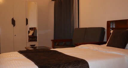 HOTEL TIBET (FTCI Cottages) Room Type - Deluxe room with king size bed, sit-out and out door swimming pool HOTEL TIBET (FTCI Cottages) Room Type - Deluxe room with king size bed, sit-out and out door swimming pool