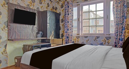 Collection O Kursoo Rajbagh Formerly Mid Valley Residency Room Type - Deluxe