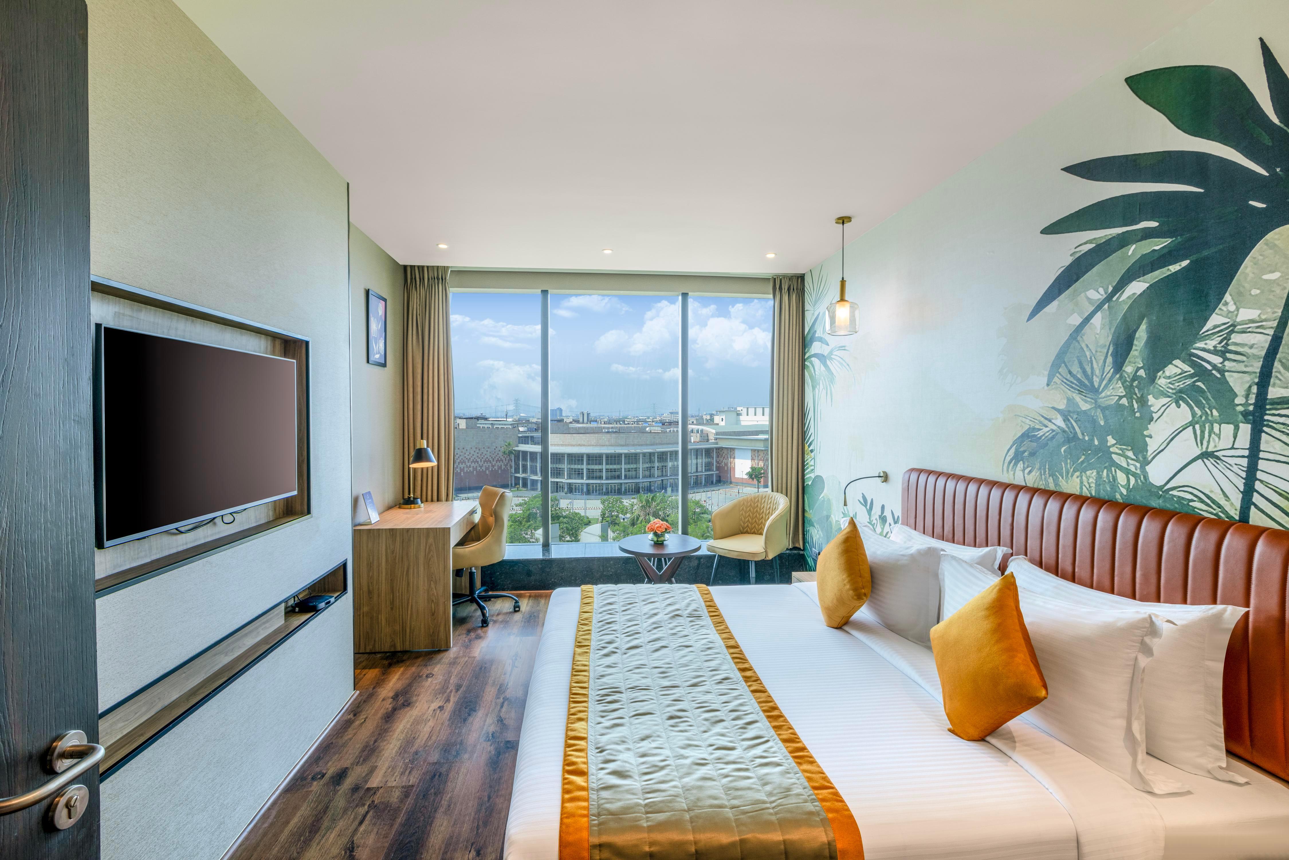 Plume Hotel - India Expo Mart - Tap to explore photos