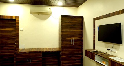 SURYAVAN HOLIDAYS Room Type - Deluxe Room with Queen Bed